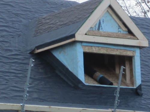 Dormer with roofing underlayment during roof work