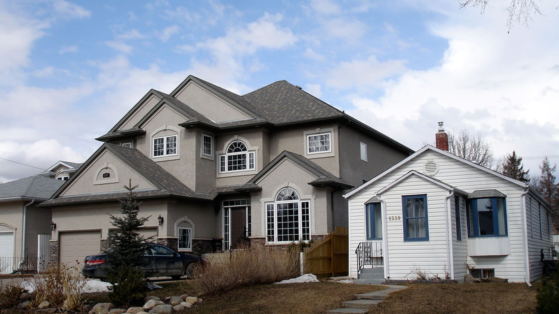 Two-story suburban home with asphalt roof