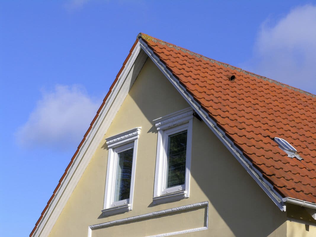 House gable with dormer and asphalt roofing